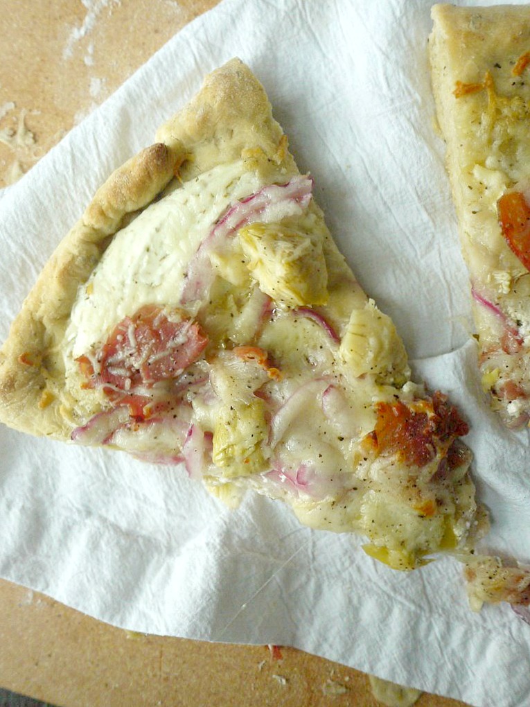 artichoke and prosciutto pizza with yogurt-feta sauce 15