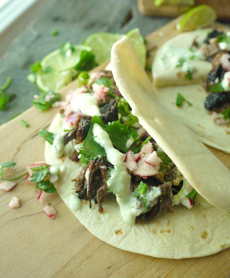 beer braised lamb tacos with chive tzatziki 12